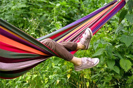 small child lying in a hammock in the woods Stock Photo - Budget Royalty-Free & Subscription, Code: 400-04397369