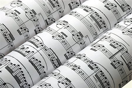 Three music sheets on a row isolated in white Stock Photo - Budget Royalty-Free & Subscription, Code: 400-04397674