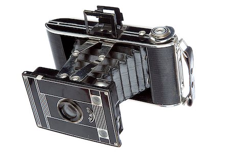 Old camera vintage isolated on a white background Stock Photo - Budget Royalty-Free & Subscription, Code: 400-04397930