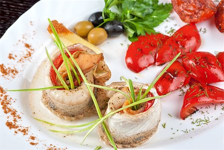 fillet of pikeperch stuffed with trout fish with baked pepper, tomato and leek Stock Photo - Budget Royalty-Free & Subscription, Code: 400-04397988