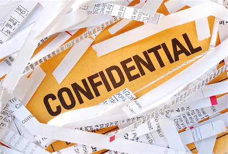 shredded document - The word Confidential surrounded by some shredded papers Stock Photo - Budget Royalty-Free & Subscription, Code: 400-04398032