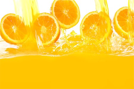 Fresh oranges falling in juice with lot of huge splashes Fotografie stock - Microstock e Abbonamento, Codice: 400-04398165