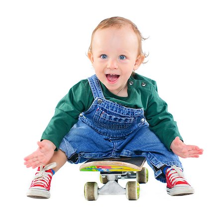 simsearch:400-05260723,k - Cute 1 years old boy on a skateboard in the studio Foto de stock - Super Valor sin royalties y Suscripción, Código: 400-04398205