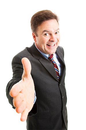 simsearch:400-05347520,k - Pushy salesman with an oversized grin, coming in for a handshake.  Isolated on white. Photographie de stock - Aubaine LD & Abonnement, Code: 400-04398436
