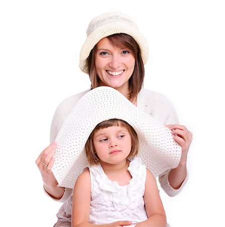 A portrait of a mother and her baby girl both in hats over white background Stock Photo - Budget Royalty-Free & Subscription, Code: 400-04398511