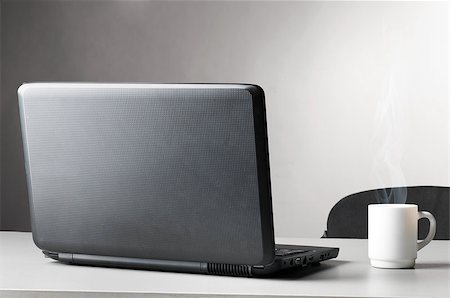 simsearch:400-04386602,k - modern black laptop with white cup of coffee with steam Stockbilder - Microstock & Abonnement, Bildnummer: 400-04398567