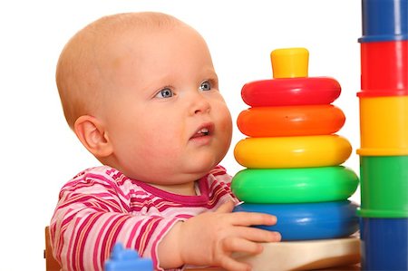 Portrait of a baby girl playing with a toy pyramid Stock Photo - Budget Royalty-Free & Subscription, Code: 400-04398716