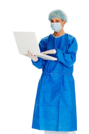 doctor with cap and mask - female surgeon holding laptop Stock Photo - Budget Royalty-Free & Subscription, Code: 400-04398932