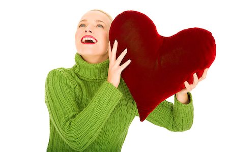 Woman with heart-shaped pillow Stock Photo - Budget Royalty-Free & Subscription, Code: 400-04398947