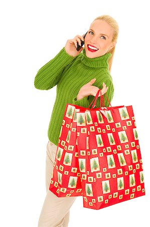 Woman with mobile and bags with Christmas gifts Stock Photo - Budget Royalty-Free & Subscription, Code: 400-04398948