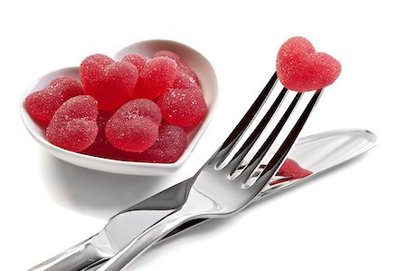 Red heart shaped jelly sweets with knife and fork on white background Stock Photo - Budget Royalty-Free & Subscription, Code: 400-04399006