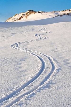footprint winter landscape mountain - Curly trace of skis on the snow in the mountains of Antarctica Stock Photo - Budget Royalty-Free & Subscription, Code: 400-04399404