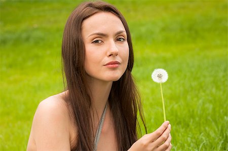 simsearch:400-04107729,k - Girl with dandelion on green field Stock Photo - Budget Royalty-Free & Subscription, Code: 400-04399504