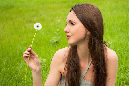 simsearch:400-04107729,k - Girl with dandelion on green field Stock Photo - Budget Royalty-Free & Subscription, Code: 400-04399503
