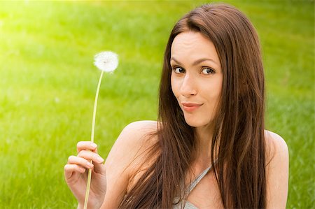 simsearch:400-04107729,k - Girl with dandelion on green field Stock Photo - Budget Royalty-Free & Subscription, Code: 400-04399513