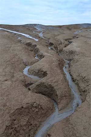 Strange landscape produced bu active mud volcanoes. Location: Buzau Romania Foto de stock - Royalty-Free Super Valor e Assinatura, Número: 400-04399584