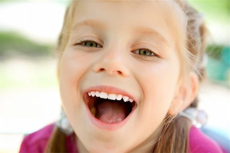 simsearch:400-05342069,k - cute little girl smiling in a park close-up Stock Photo - Budget Royalty-Free & Subscription, Code: 400-04390378