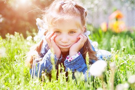 simsearch:400-05342069,k - cute little girl smiling in a park close-up Stock Photo - Budget Royalty-Free & Subscription, Code: 400-04390385