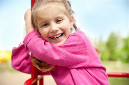 simsearch:400-05342069,k - cute little girl smiling in a park close-up Stock Photo - Budget Royalty-Free & Subscription, Code: 400-04390388