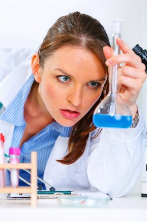 simsearch:400-07099889,k - Pensive doctor woman in laboratory analyzing results of medical test Stock Photo - Budget Royalty-Free & Subscription, Code: 400-04390415