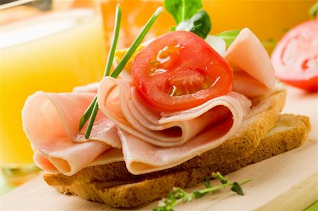 phto of delicious toast with ham on wooden table with orange juice Stock Photo - Budget Royalty-Free & Subscription, Code: 400-04390529