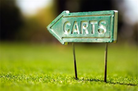 Golf carts sign on a golf field. Small depth of field. Stock Photo - Budget Royalty-Free & Subscription, Code: 400-04391018