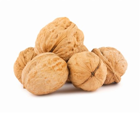 simsearch:400-05265990,k - Ripe brown walnuts isolated on white background Stock Photo - Budget Royalty-Free & Subscription, Code: 400-04391011