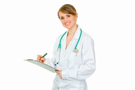 simsearch:400-04351236,k - Smiling  doctor woman making notes in medical chart isolated on white Photographie de stock - Aubaine LD & Abonnement, Code: 400-04391115