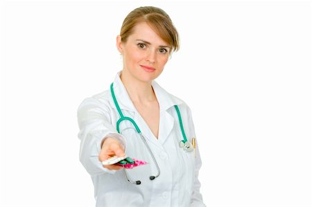 simsearch:400-04880039,k - Smiling medical female doctor holding packs of pills in hand isolated on white Foto de stock - Super Valor sin royalties y Suscripción, Código: 400-04391117