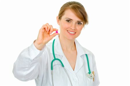 simsearch:400-07099882,k - Smiling medical doctor woman holding  pill in hand isolated on white Photographie de stock - Aubaine LD & Abonnement, Code: 400-04391118