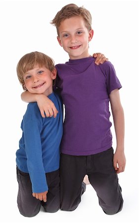 two happy brothers against white background Foto de stock - Super Valor sin royalties y Suscripción, Código: 400-04391209