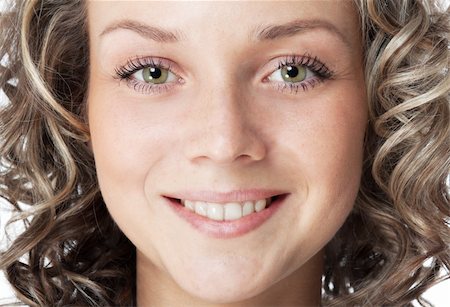 Closeup portrait of a smiling young woman. Green eyes and toothy smile Stock Photo - Budget Royalty-Free & Subscription, Code: 400-04391411