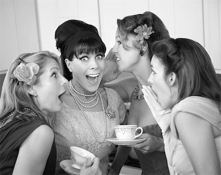 Group of four excited housewives in a kitchen share secrets Stock Photo - Budget Royalty-Free & Subscription, Code: 400-04391471