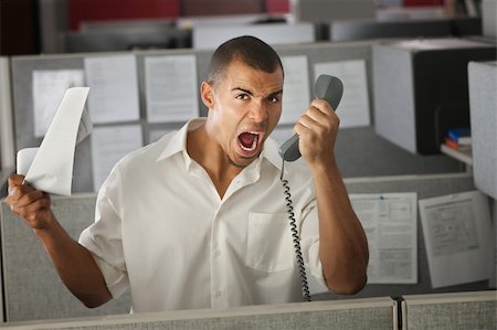 Frustrated office worker yelling on phone in his cubicle Stock Photo - Budget Royalty-Free & Subscription, Code: 400-04391515