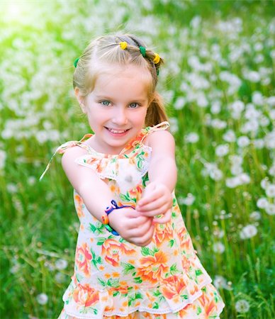 simsearch:400-06768635,k - Cute little girl  on the meadow in summer day Foto de stock - Royalty-Free Super Valor e Assinatura, Número: 400-04392519