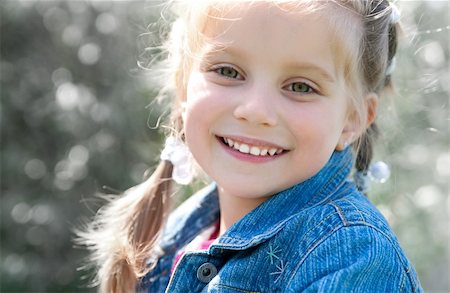 simsearch:400-05342069,k - cute little girl smiling in a park close-up Stock Photo - Budget Royalty-Free & Subscription, Code: 400-04393194