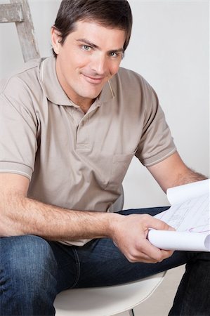 diy chair - Portrait of happy mature man holding a blueprint plan in his hand Stock Photo - Budget Royalty-Free & Subscription, Code: 400-04393266