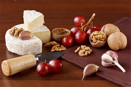 french lifestyle and culture - French cheese camembert, nuts, red grapes and garlic Stock Photo - Budget Royalty-Free & Subscription, Code: 400-04393719