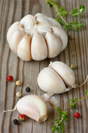 simsearch:400-04689367,k - Garlic, colorful peppercorns and thyme on an old wooden board. Stock Photo - Budget Royalty-Free & Subscription, Code: 400-04393765