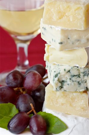 simsearch:400-04184502,k - Pyramid of cheese, red grapes, wine and basil. Stock Photo - Budget Royalty-Free & Subscription, Code: 400-04393790