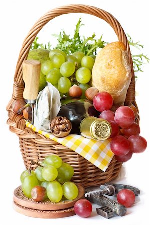 Grapes, wine, nuts, cheese and ciabatta in a wicker basket. Stock Photo - Budget Royalty-Free & Subscription, Code: 400-04393803
