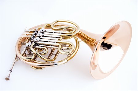 A French horn isolated close-up against a high key white background in the horizontal view with copy space. Stock Photo - Budget Royalty-Free & Subscription, Code: 400-04393908