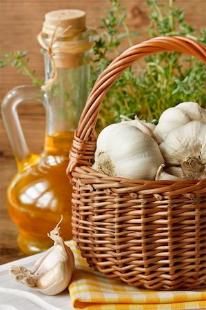 Garden garlic on basket, thyme and olive oil. Stock Photo - Budget Royalty-Free & Subscription, Code: 400-04393903