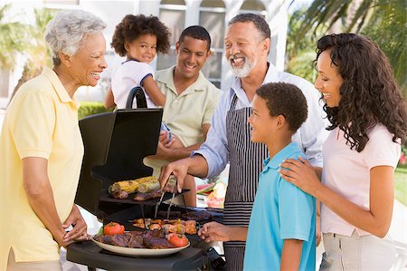 Family Enjoying A Barbeque Stock Photo - Budget Royalty-Free & Subscription, Code: 400-04404149
