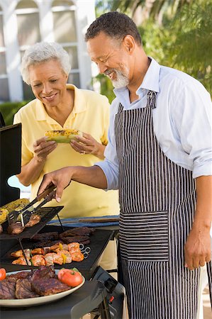 Couple Cooking On A Barbeque Stock Photo - Budget Royalty-Free & Subscription, Code: 400-04404142