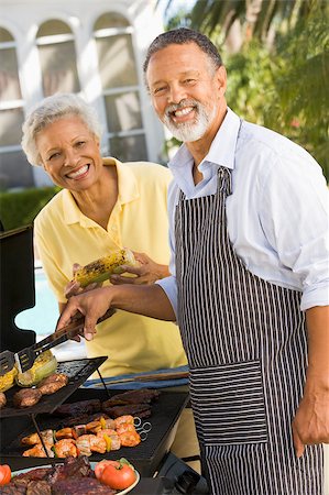 Couple Cooking On A Barbeque Stock Photo - Budget Royalty-Free & Subscription, Code: 400-04404143