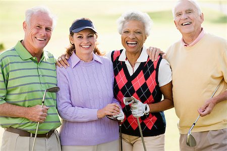 senior couple golf - Portrait Of Four Friends Enjoying A Game Golf Stock Photo - Budget Royalty-Free & Subscription, Code: 400-04404234