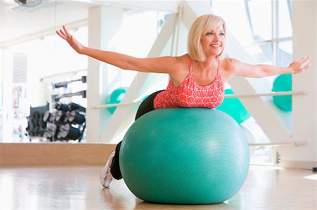 fitness   mature woman - Woman Balancing On Swiss Ball Stock Photo - Budget Royalty-Free & Subscription, Code: 400-04404329