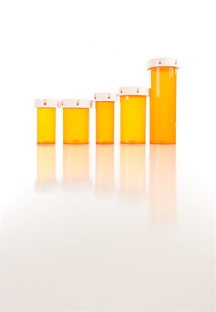 simsearch:400-08862116,k - Several Different Sized Empty Medicine Bottles as Increasing Graph on Reflective Surface. Stock Photo - Budget Royalty-Free & Subscription, Code: 400-04404882