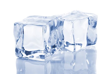 Ice cubes isolated on a white reflecting table Stock Photo - Budget Royalty-Free & Subscription, Code: 400-04404925